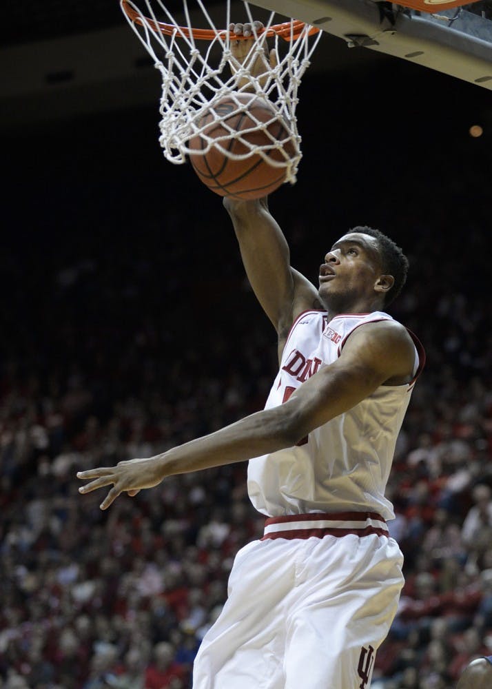 Sophomore forward Troy Williams dunks the ball during IU's game against North Carolina-Greensboro on Friday at Assembly Hall.