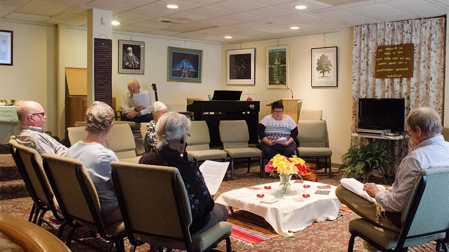 Members of the Bahá’í Faith community of Bloomington read passages during an interfaith devotional time Sunday.
