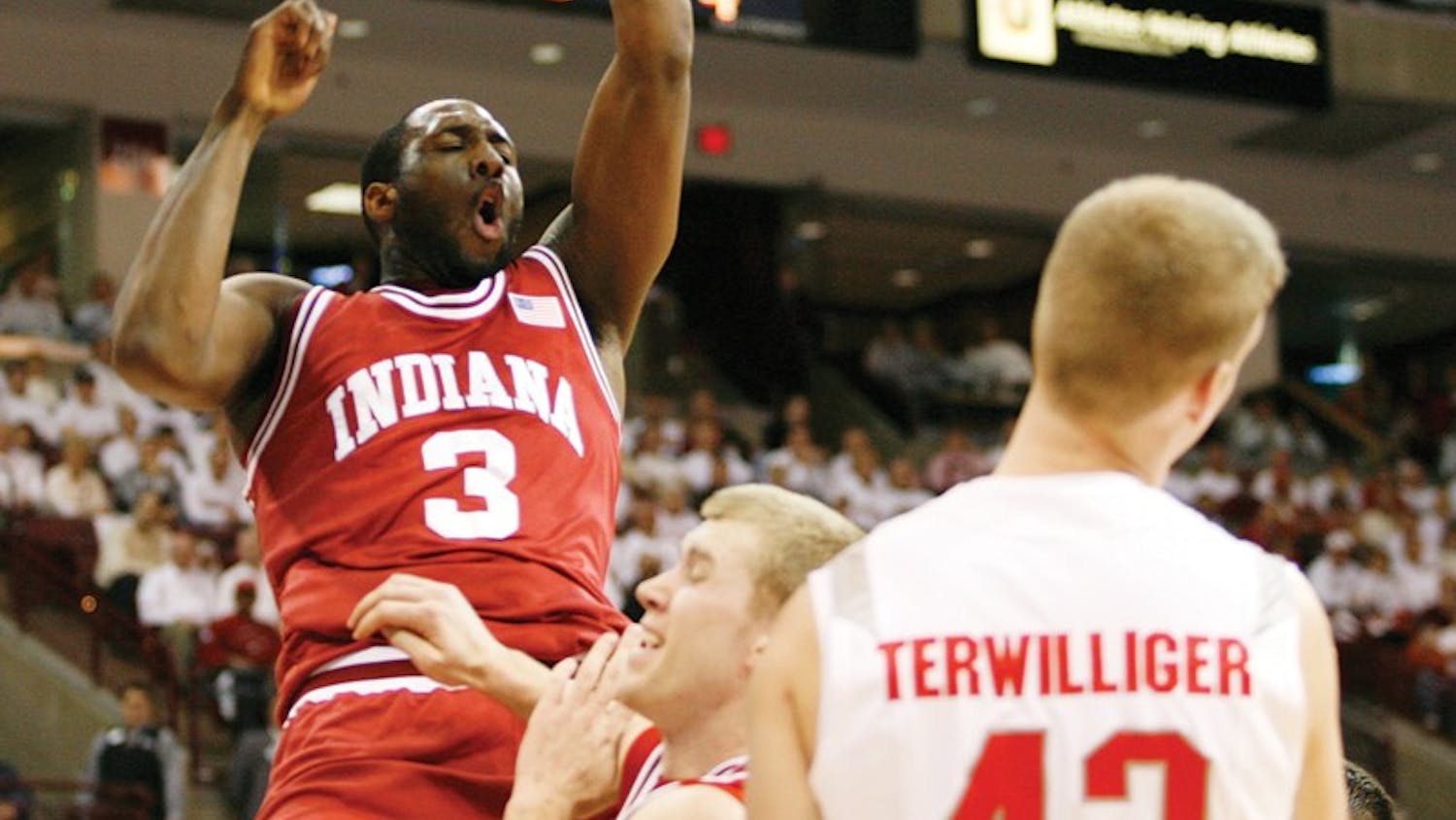 IDS FILE PHOTO
Senior forward D.J. White slams the ball over teammate Lance Stemler and Ohio State's Matt Terwilliger (42) Sunday, Feb. 10 in Columbus, Ohio. White, and former IU guard Eric Gordon, are expected to be drafted in Thursday's NBA Draft.