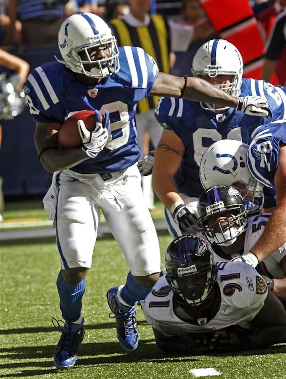 Indianapolis Colts running back Dominic Rhodes runs with the ball in the second half against the Baltimore Ravens on Sunday in an NFL football game in Indianapolis. Indianapolis won 31-3.