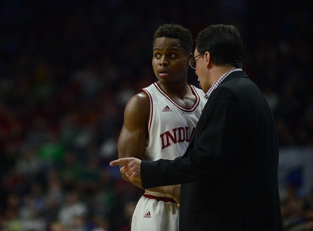 IU Coach Tom Crean talks to senior guard Yogi Ferrell during the NCAA Tournament game against Chattanooga on Thursday at the Wells Fargo Arena in Des Moines, Iowa. The Hoosiers won 99-74.