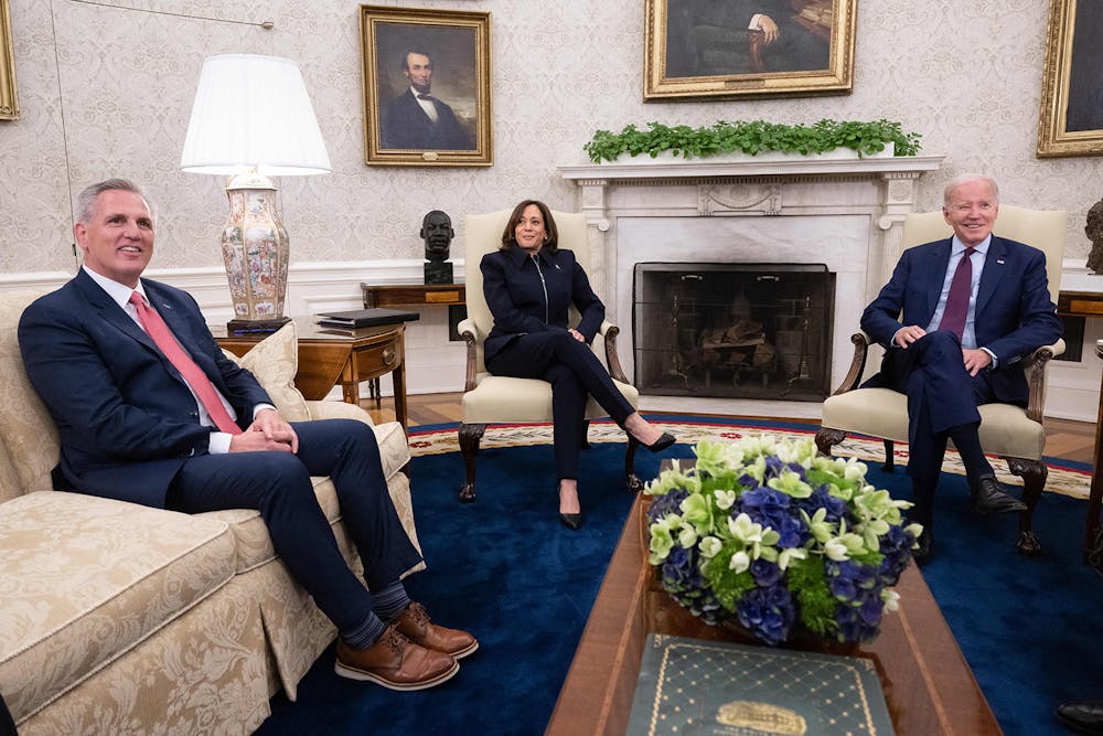 <p>U.S. President Joe Biden (right), joined by U.S. Vice President Kamala Harris, speaks during a meeting regarding the debt limit, with U.S. House Speaker Kevin McCarthy (R-CA) and other Congressional leaders, May 16, 2023, in the Oval Office of the White House in Washington, D.C.. Their newly-introduced legislation ends a three year-long student loan payment pause introduced during the COVID-19 pandemic.  </p>