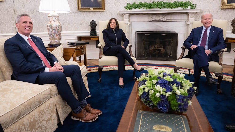 U.S. President Joe Biden (right), joined by U.S. Vice President Kamala Harris, speaks during a meeting regarding the debt limit, with U.S. House Speaker Kevin McCarthy (R-CA) and other Congressional leaders, May 16, 2023, in the Oval Office of the White House in Washington, D.C.. Their newly-introduced legislation ends a three year-long student loan payment pause introduced during the COVID-19 pandemic.  