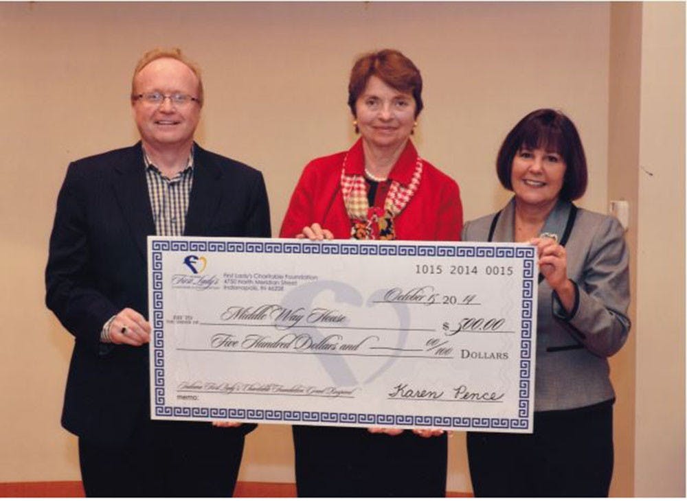 Jim Davis and Sue Owen of Middle Way House accept a grant from Indiana First Lady Karen Pence. The Indiana First Lady's Charitable Foundation gave out $15,000 in grants to 19 organizations. 