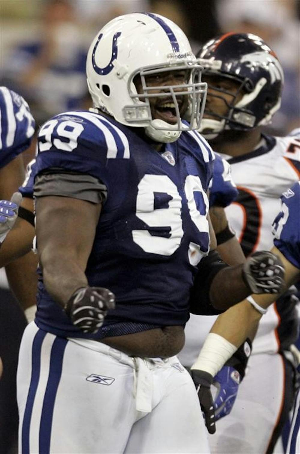 Indianapolis Colts defensive tackle Ed Johnson (99) reacts during a NFL football game against the Denver Broncos on Sept. 30 in Indianapolis. Johnson was arrested early Wednesday north of Indianapolis, on a drug possession charge. Colts president Bill Polian said the team was still gathering facts about the case before determining how it will discipline Johnson, but Johnson will not play Sunday at Minnesota.