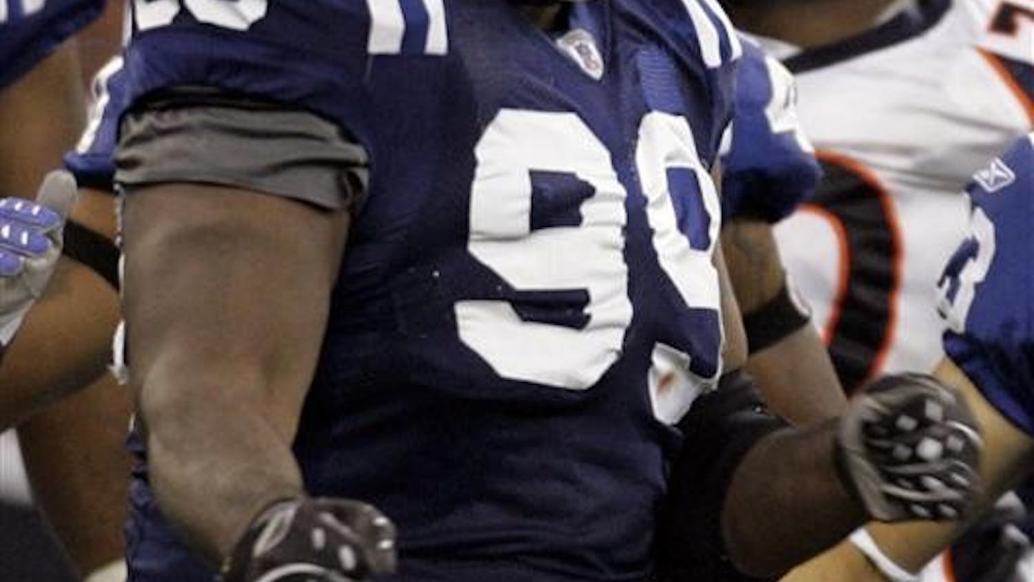 Indianapolis Colts defensive tackle Ed Johnson (99) reacts during a NFL football game against the Denver Broncos on Sept. 30 in Indianapolis. Johnson was arrested early Wednesday north of Indianapolis, on a drug possession charge. Colts president Bill Polian said the team was still gathering facts about the case before determining how it will discipline Johnson, but Johnson will not play Sunday at Minnesota.
