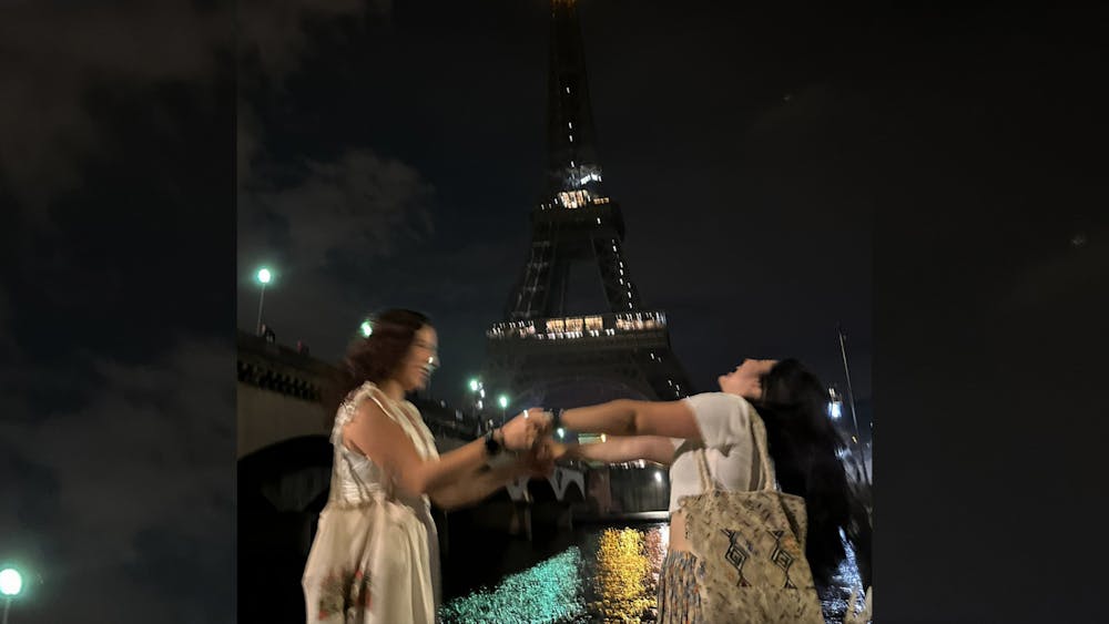 Gentry Keener and Jasmine Casaña are photographed June 11, 2023, at the Eiffel Tower in Paris. &quot;Paris Syndrome&quot; is defined as “A sense of extreme disappointment exhibited by some individuals when visiting Paris, who feel that the city was not what they had expected.”  