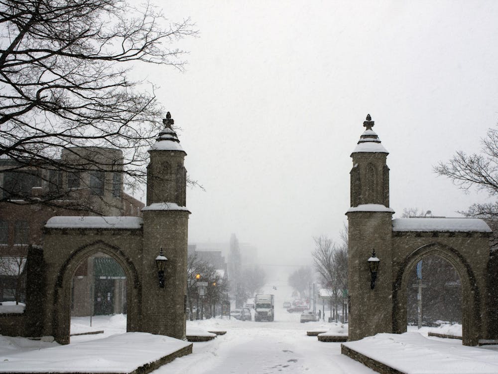 Snow flurries fall near the Sample Gates on Feb. 15, 2021. The National Weather Service issued a winter storm warning for central Indiana until 7 p.m. Friday. 