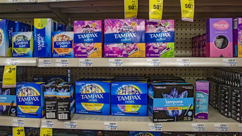 Boxes of tampons sit on shelves March 8 in the CVS on the corner Kirkwood Avenue and Washington Street. 