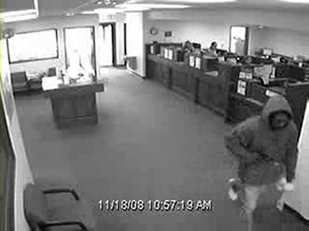This photo, taken from surveillance footage, shows the suspect of a bank robbery that occurred approximately at 11 AM on Tuesday at People's State Bank at 525 S. Clarizz Boulevard near College Mall.