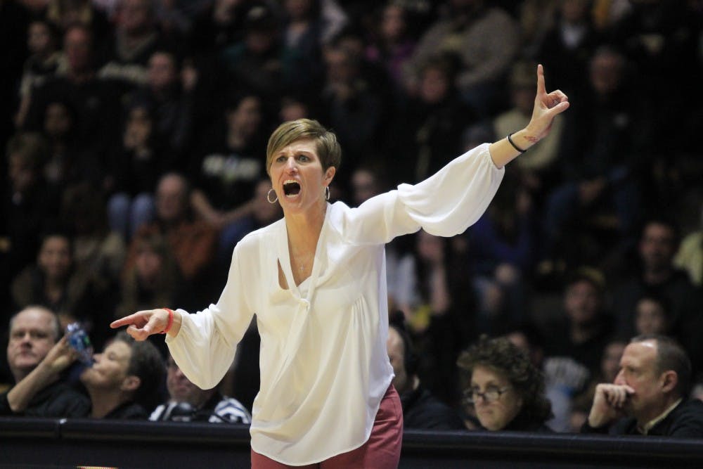 <p>Women's basketball coach Teri Moren shouts at her team, encouraging them to get a move on. IU traveled to West Lafayette, Indiana, to face Purdue and won 52-44.</p>