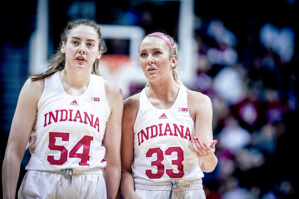 <p>Senior forward MacKenzie Holmes and junior guard Sydney Parrish discuss a foul Jan. 29, 2023, at Simon Skjodt Assembly Hall in Bloomington. The Hoosiers beat Minnesota 77-54.</p>