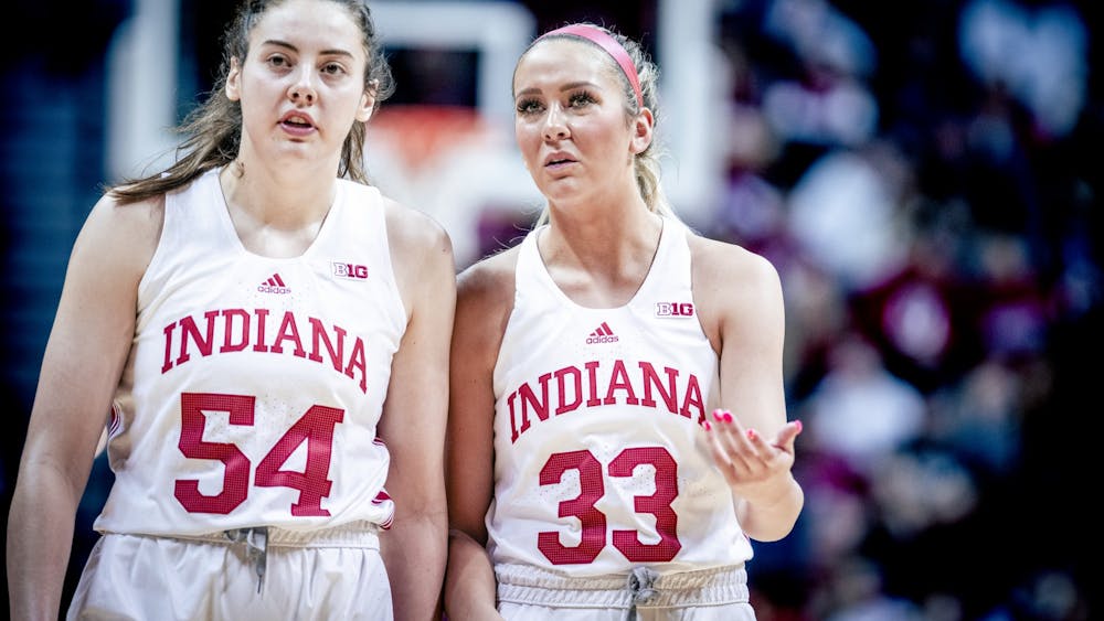 Senior forward MacKenzie Holmes and junior guard Sydney Parrish discuss a foul Jan. 29, 2023, at Simon Skjodt Assembly Hall in Bloomington. The Hoosiers beat Minnesota 77-54.