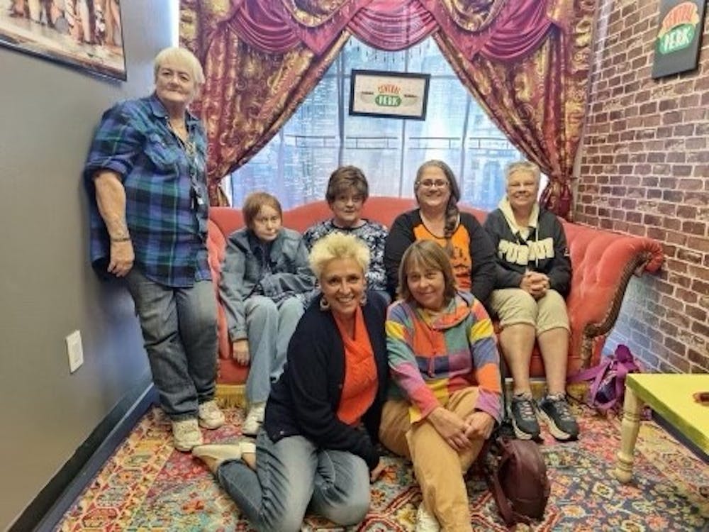 Darla Jones, front left, poses with other members of Hot Old Broads Oct. 2 near the end of their crafting event. They are gathered in an alcove of the shop decorated to mimic Central Perk, the coffeehouse featured on the show &quot;Friends.&quot;