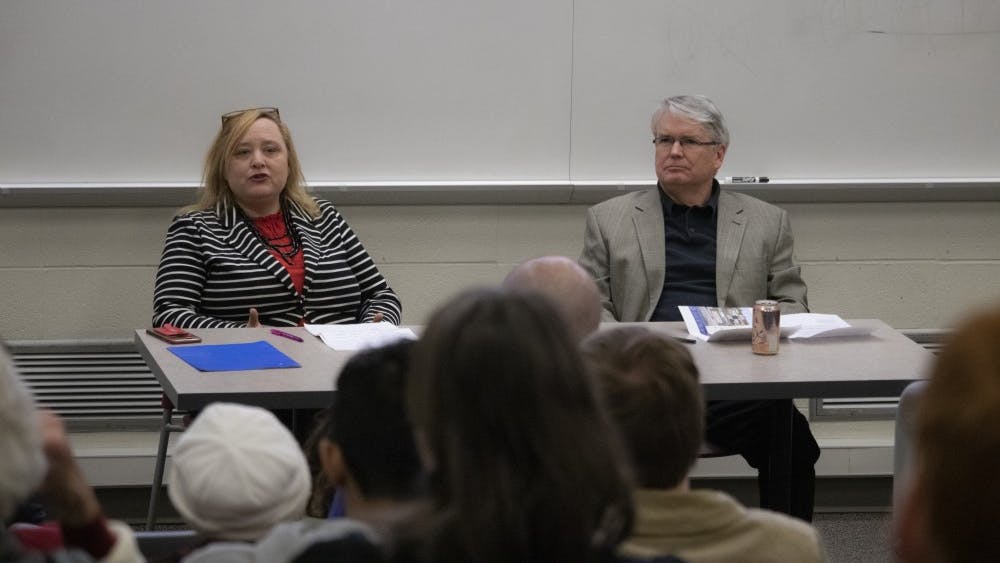 Mayor John Hamilton and mayoral candidate Amanda Barge speak Feb. 26 at a panel hosted by Habitat for Humanity. Hamilton and Barge spoke about current student housing issues and how to make housing more affordable.&nbsp;