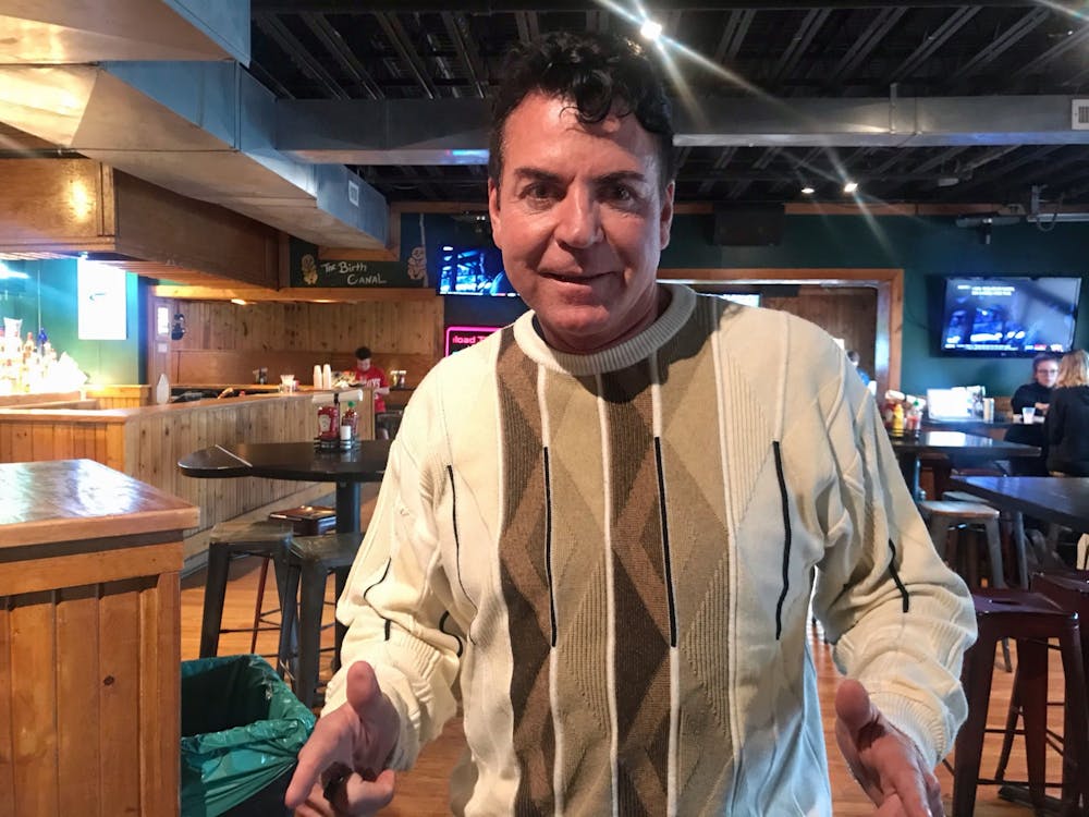 <p>Papa John’s founder and former CEO John Schnatter poses for a photo Feb. 16 at Kilroy&#x27;s on Kirkwood. Schnatter handed out $10 Papa John&#x27;s gift cards during his visit.</p>