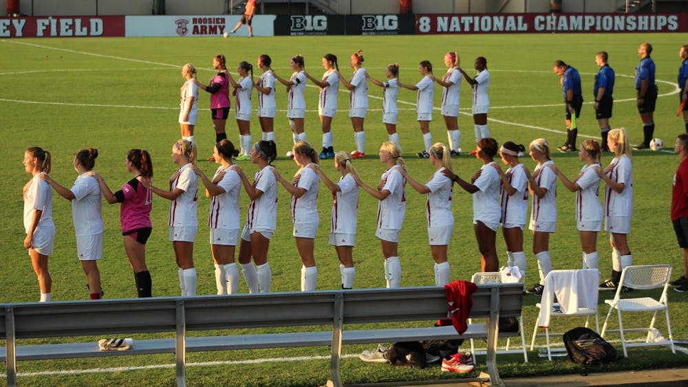 IU's Womens Soccer team stands during the National Anthem at Friday's game against Minnesota.