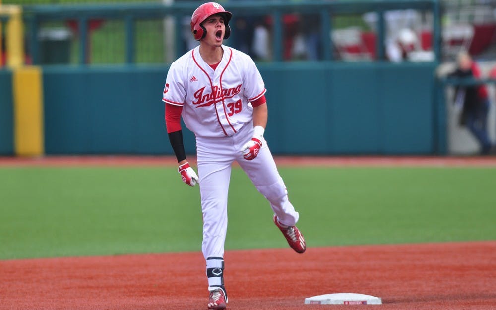 Senior Craig Dedelow celebrates his RBI double at second base, which would ultimately be the Hoosiers’ only run in a 3-1 loss to Nebraska.