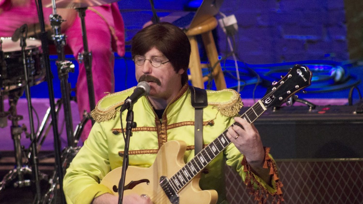 The Mersey Beatles play their set Friday night at the Buskirk-Chumley Theater, which was packed for the tribute band's third performance in Bloomington. All of the Mersey Beatles are from Liverpool, the hometown of the original Beatles quartet. 