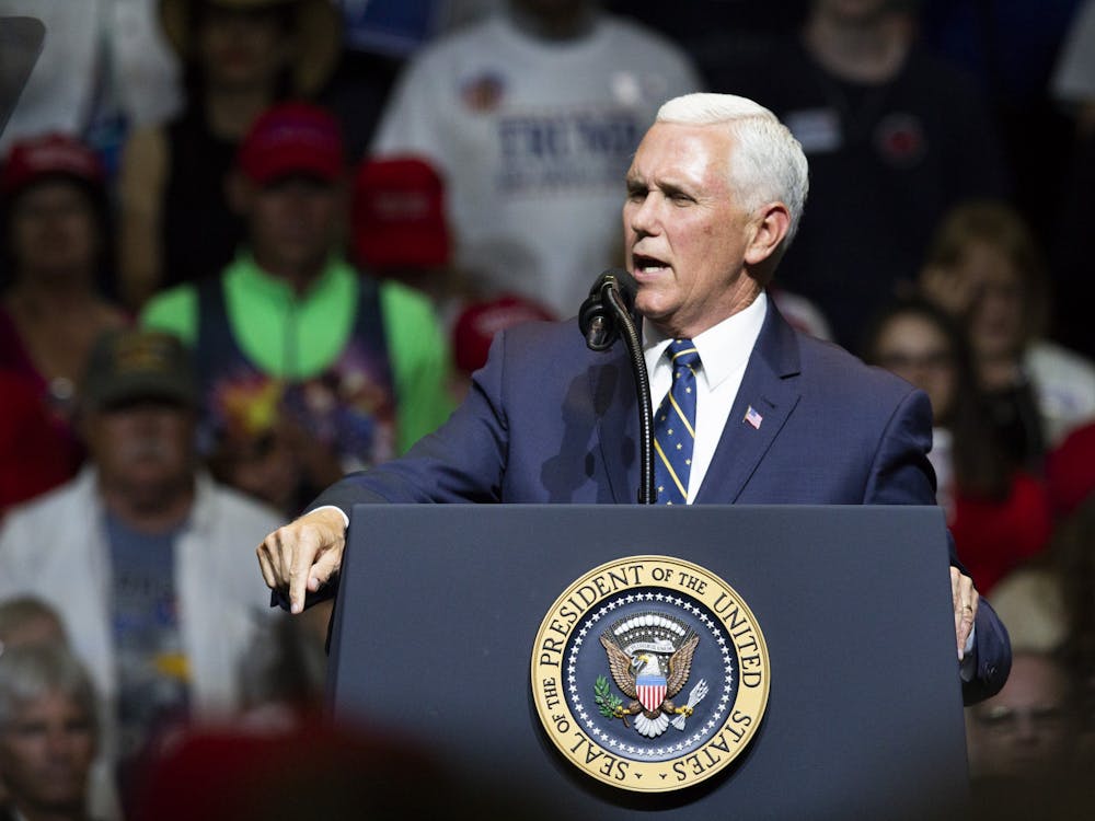 Vice President Mike Pence talks with supporters at a rally May 10, 2018, at North Side Middle School in Elkhart, Indiana. Pence is visiting Bloomington on Tuesday to tour a vaccine production facility, his office announced Friday.