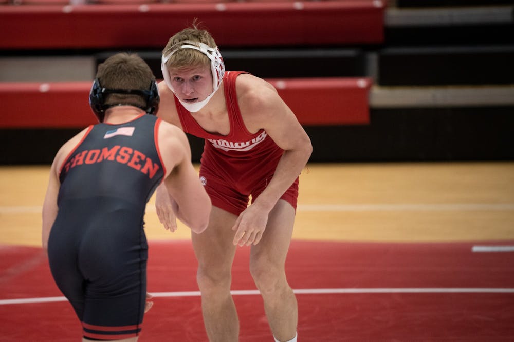 <p>Senior Kyle Luigs sizes up his opponent Feb. 6 at Wilkinson Hall. Luigs won his senior day match against Maryland on Sunday in Wilkinson Hall. </p>