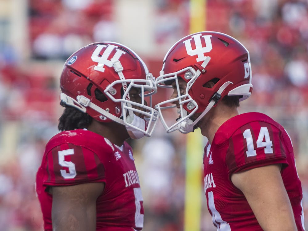 Then-graduate running back Stephen Carr and then-redshirt junior quarterback Jack Tuttle celebrate Carr&#x27;s touchdown Oct. 16, 2021, at Memorial Stadium. Indiana will face Nebraska this Saturday in Lincoln, Nebraska.