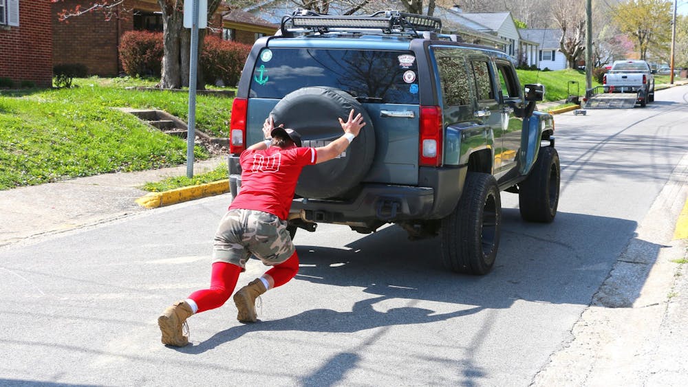 <p>Freshman pitcher AJ Hacker pushes a car while training from home. IU athletes have been forced to find new ways of training away from the weight room as a result of COVID-19.</p>
