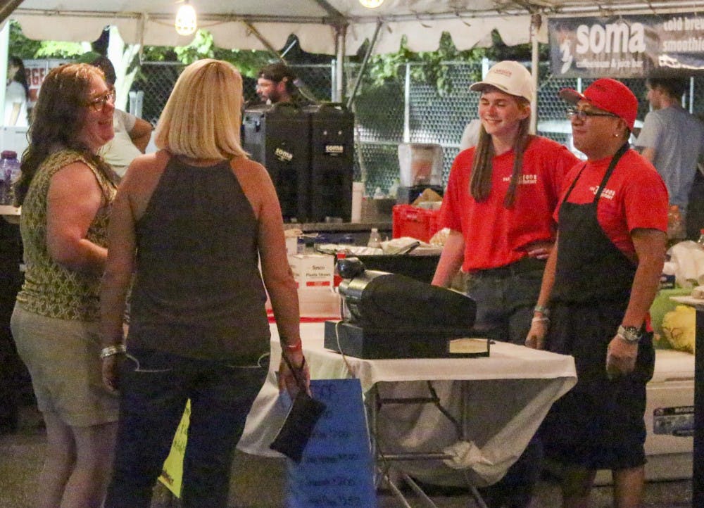 People participate in the Taste of Bloomington at Saturday evening at Showers Common. This event brought together many restaurants, wineries and breweries in Bloomington.