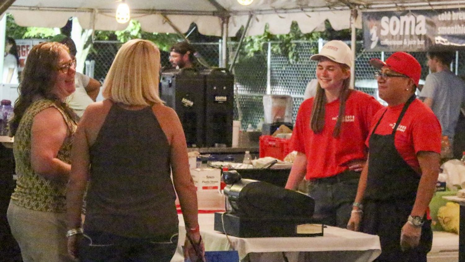 People participate in the Taste of Bloomington at Saturday evening at Showers Common. This event brought together many restaurants, wineries and breweries in Bloomington.
