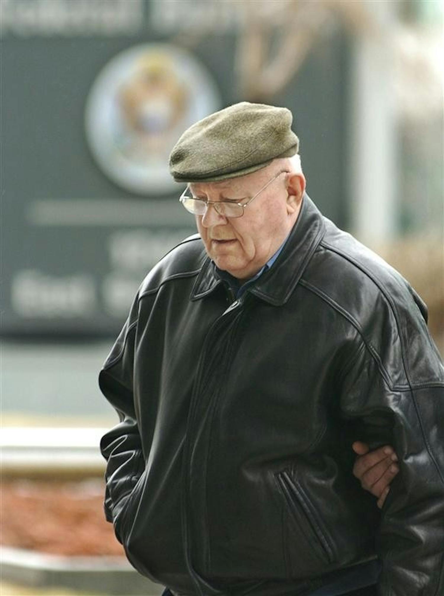 In this Feb. 28, 2005 file photo, John Demjanjuk arrives at the federal building in Cleveland for an immigration hearing. German prosecutors said Wednesday they have charged retired Ohio auto worker John Demjanjuk with more than 29,000 counts of accessory to murder for his time as a guard at the Nazis' Sobibor death camp, and will seek his extradition from the U.S.