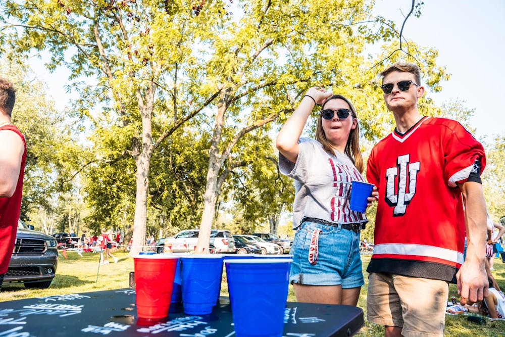 Then-senior Rachael Sebonia and Dylan Barnes play a game of pong before the Indiana Idaho football game on Sept. 11, 2021.