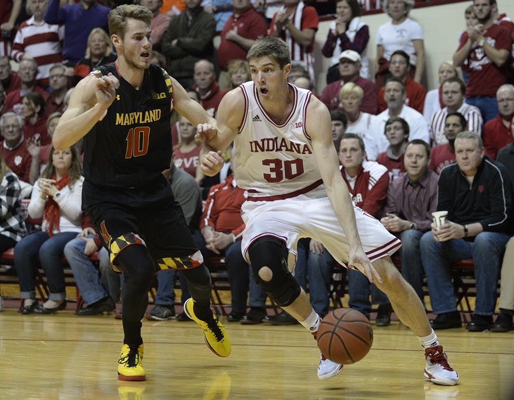 Sophomore Collin Hartman drives past his defender during IU's game against Maryland on Thursday at Assembly Hall.