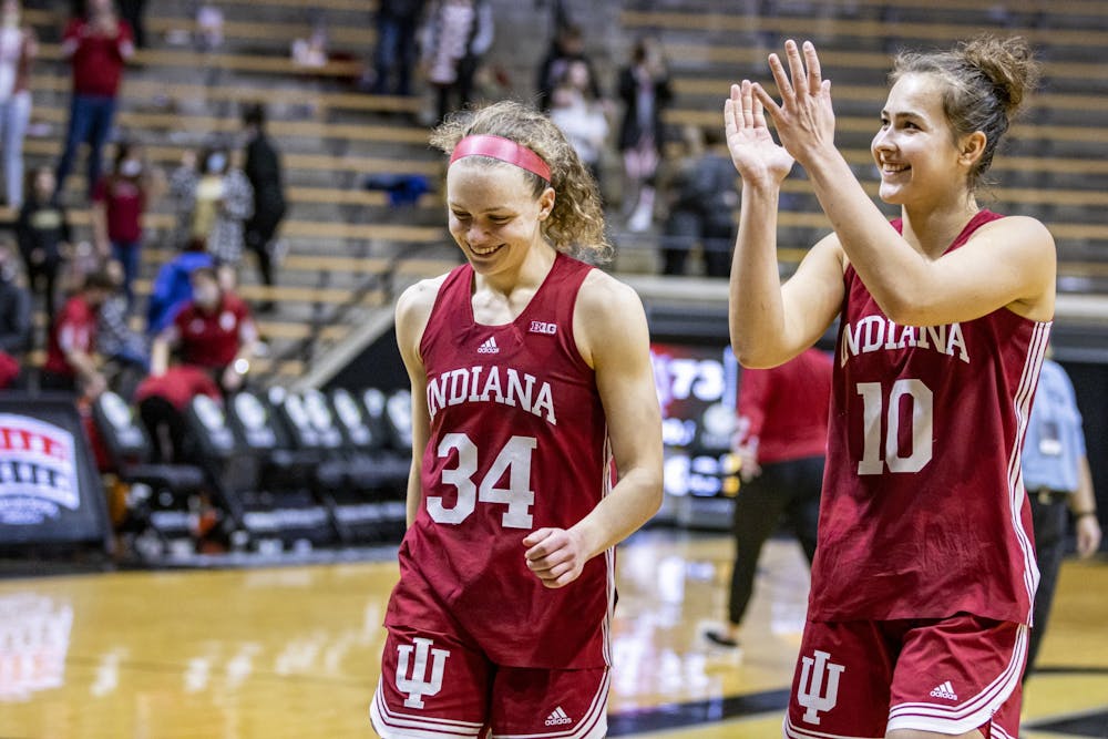 <p>Senior guard Grace Berger and senior forward Aleksa Gulbe walk off the court after the game against Purdue on Jan. 16, 2022, at Mackey Arena. Indiana lost 82-88 against Iowa on Monday. </p>