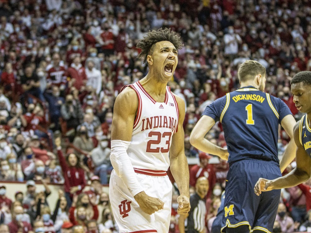 Junior forward Trayce Jackson-Davis celebrates after a dunk against Michigan on Saturday at Simon Skjodt Assembly Hall. Indiana fell to Michigan 80-62.