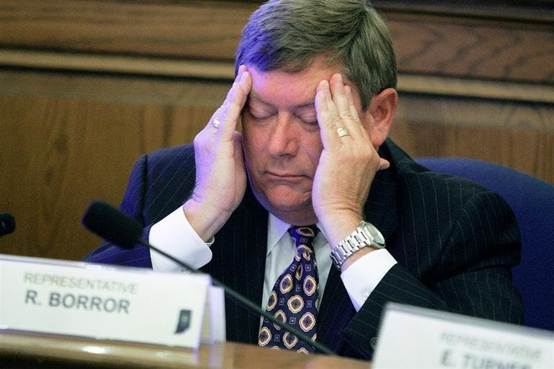 Rep. Randy Borror, R-Fort Wayne, reacts as Rep. Bill Crawford, D-Indianapolis, speaks before Crawford and other House Democrats walk out of a state budget hearing at the Statehouse in Indianapolis, Thursday, June 4, 2009.  