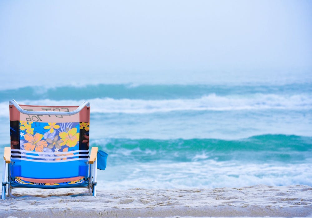 <p>A beach chair rests on the sand. Travelers can expect a different experience than pre-coronavirus pandemic travel, according to Becky Liu-Lastres, IUPUI assistant professor of Tourism, Event and Sport Management, and Evan Jordan, IU assistant professor in the Department of Recreation, Park and Tourism Studies.</p>