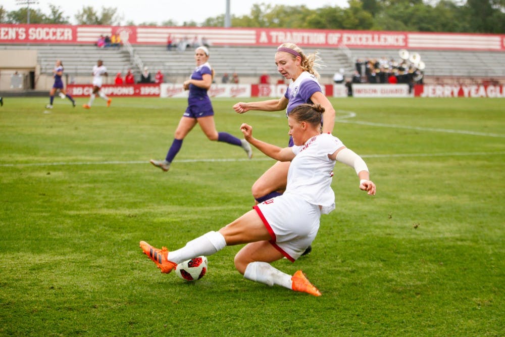 <p>Senior Annelie Leitner slides to reach the ball and keep it inbounds Sept. 9 at Bill Armstrong Stadium. IU ended the game tied against Kansas State, 0-0.</p>