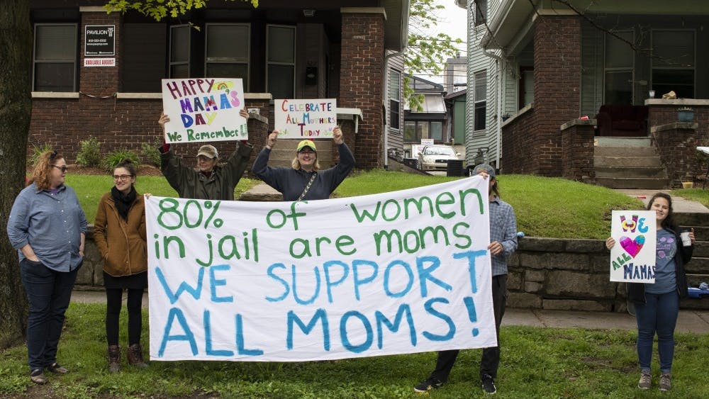 The “Mama’s Day Vigil and Banner Drop for incarcerated survivors” was put on by Middle Way House and Re-entry Collective at New Leaf-New Life. People stood with signs for two hours across the street from Charlotte T. Zietlow Justice Center. During the event, people held up a sign that read, "Eighty percent of women in jail are moms. We support all moms!"