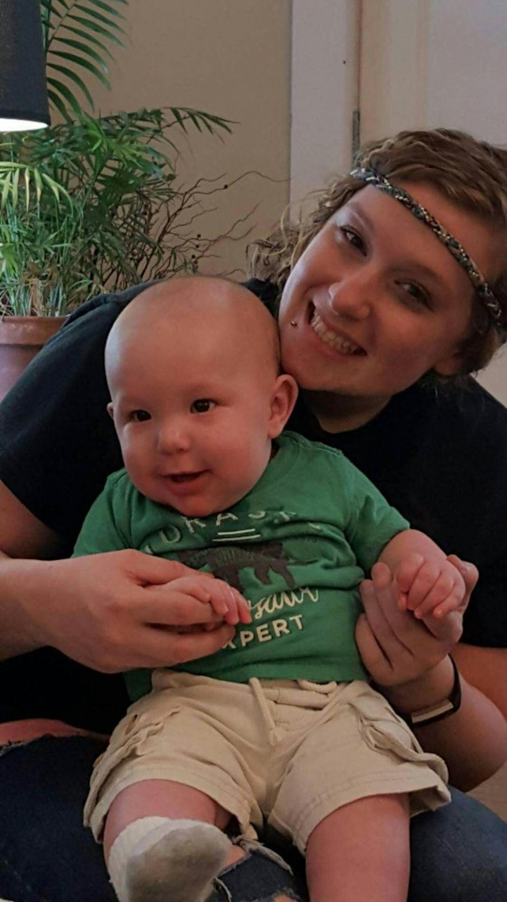 <p>Erika Hurt, 25, holds her 10-month-old son. Hurt overdosed in her car with her son in the backseat last week.&nbsp;</p>