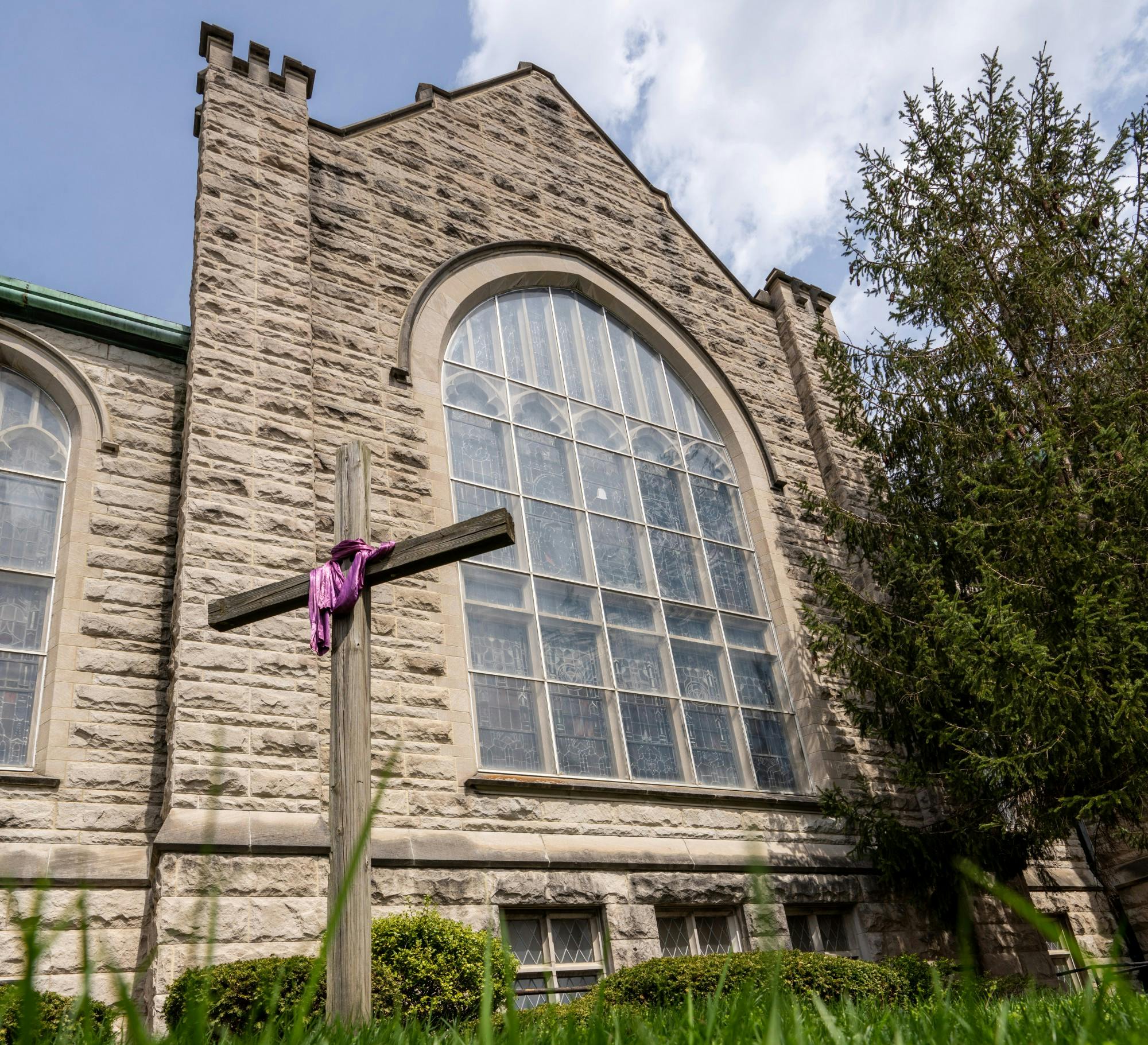 A cross stands April 7 in from of First United Methodist Church in Bloomington.