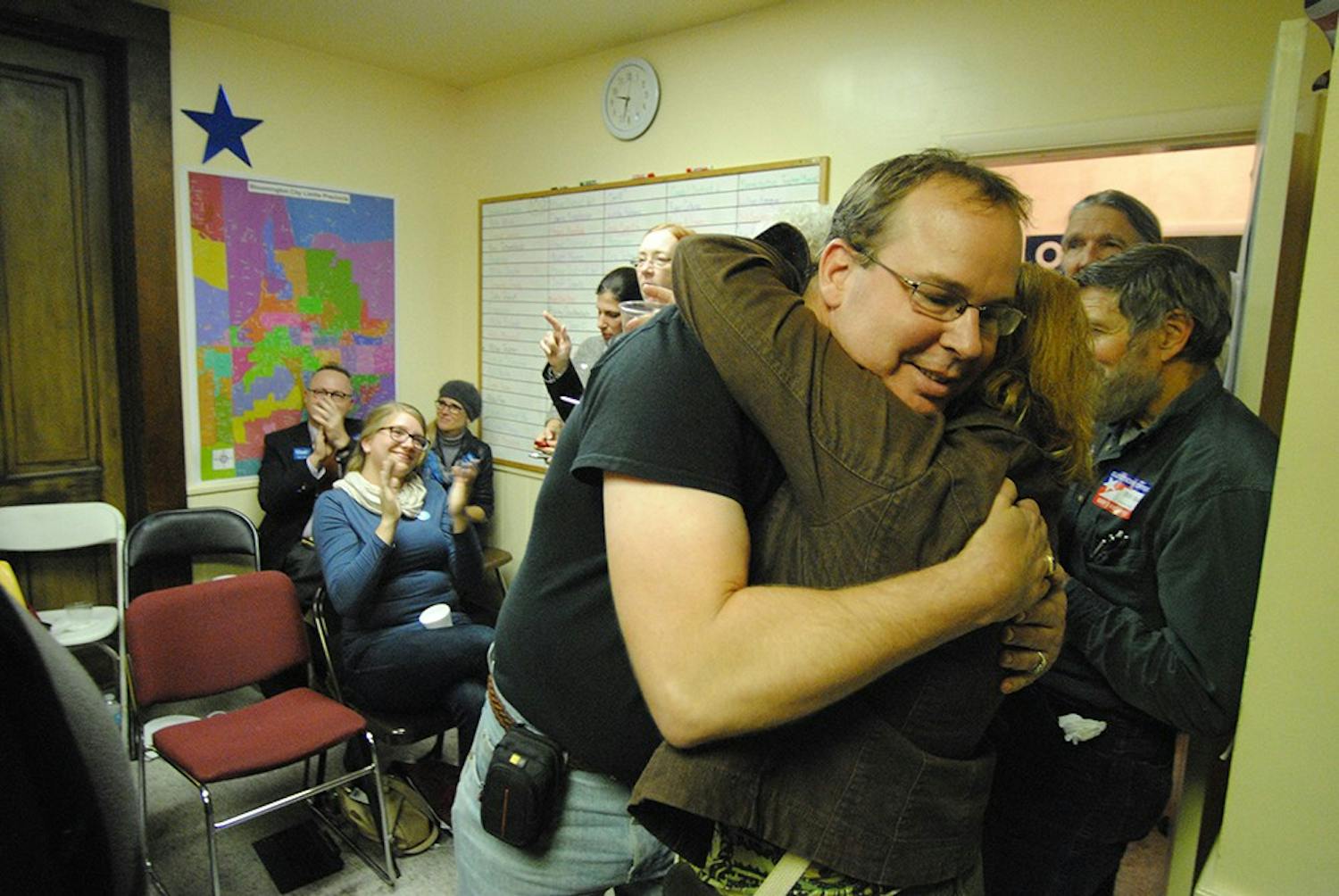 Democratic candidate Eric Schmitz, embraces his wife after his victory for Monroe County Recorder is announced. Schmitz, along with other local democrats, addressed the Monroe County watch party Tuesday night. 