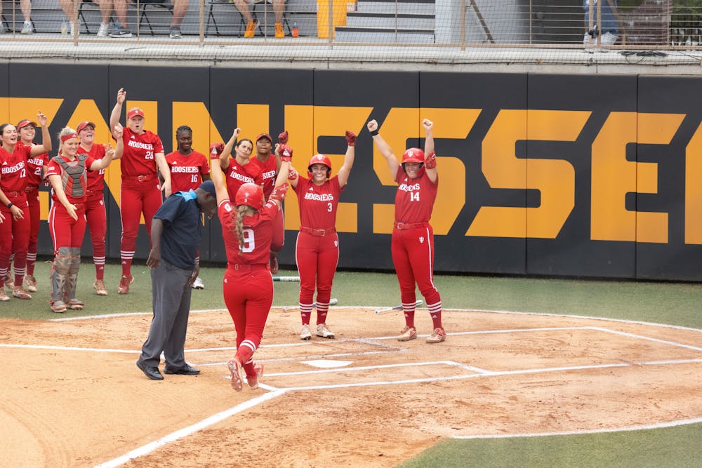 <p>Indiana softball freshman Taryn Kern celebrates hitting a home run against the University of Tennessee, May 20 in the NCAA Tournament. Kern was named one of the top three finalists for the Division I National Freshman of the Year award Thursday. </p>