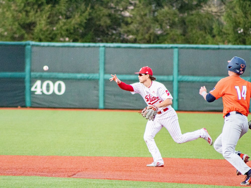 Freshman infielder Paul Toetz throws the ball to second base April 10 at Bart Kaufman Field. The IU baseball team will play a three-game series against Minnesota this weekend at home. 