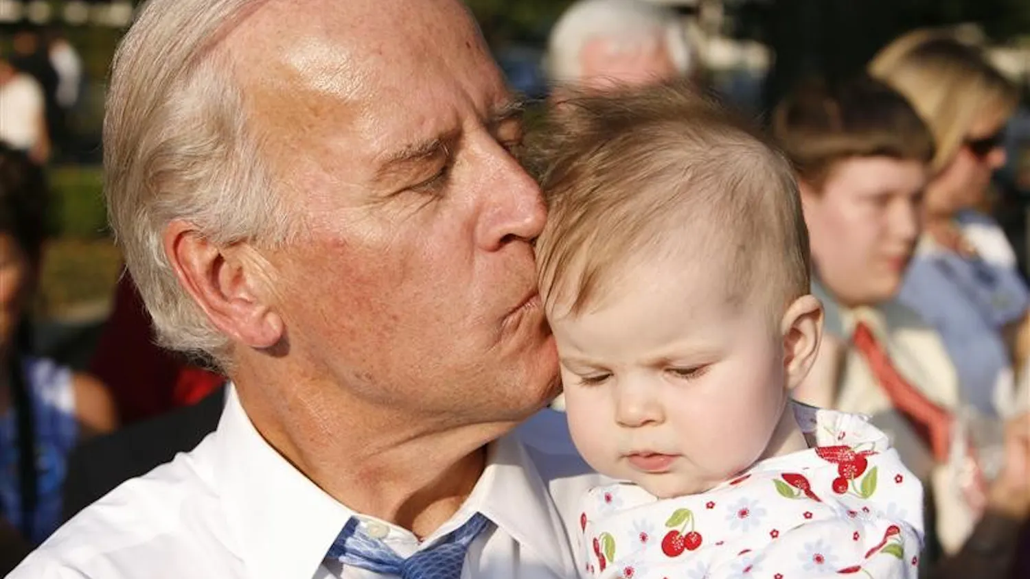 Democratic vice-presidential candidate Sen. Joe Biden kisses a supporter's baby following a rally Wednesday afternoon at Warder Park in Jeffersonville, Ind.