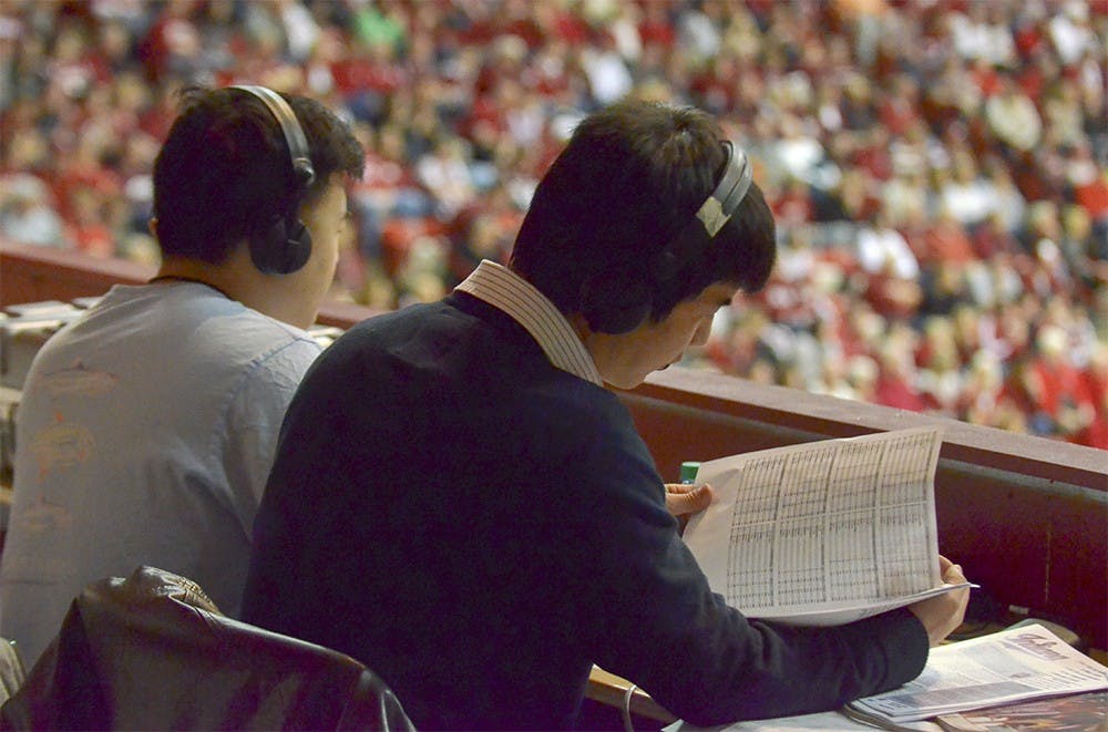 Mandarin-speaking broadcasters announce the IU basketball game against Ohio State in Mandarin on Sunday at Assembly Hall. 