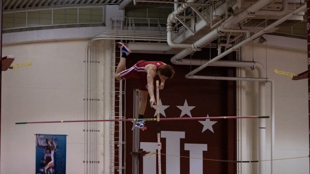 Junior Nathan Stone finishes participating in the pole vault event at the Hoosier Hills meet Feb. 11, 2022. 14 Indiana men’s track and field athletes earned bids to NCAA East Preliminary Round. 