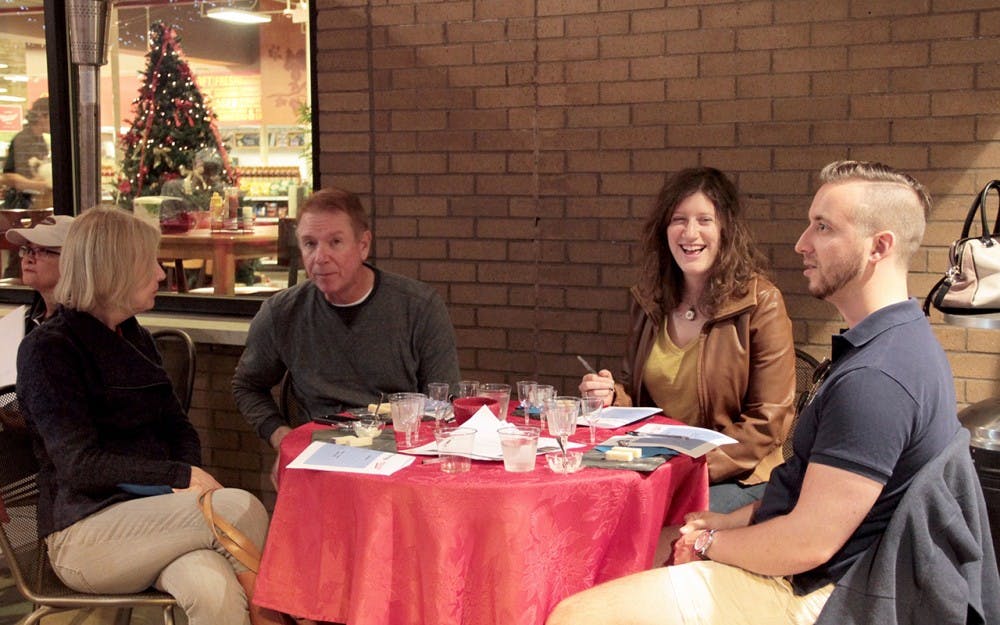 People of Bloomington taste various wines and cheese provided by Kroger on Thursday evening.