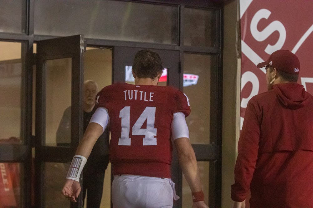 <p>Redshirt junior quarterback Jack Tuttle heads to the locker room during the fourth quarter on Oct. 25, 2021, at Memorial Stadium. Tuttle is week to week with an injury.</p>