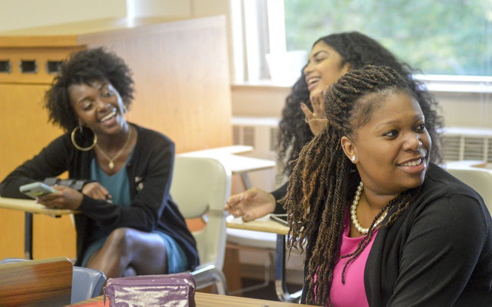 Alpha Kappa Alpha senior Tenisha Howard practices active listening by acting out scenarios regarding mental health with other AKA sisters Tuesday evening at the Ballantine Hall. The event, hosted by Alpha Kappa Alpha, Pi Lambda Phi, and CAPS, is aimed at ending the stigmas present in society against mental health.