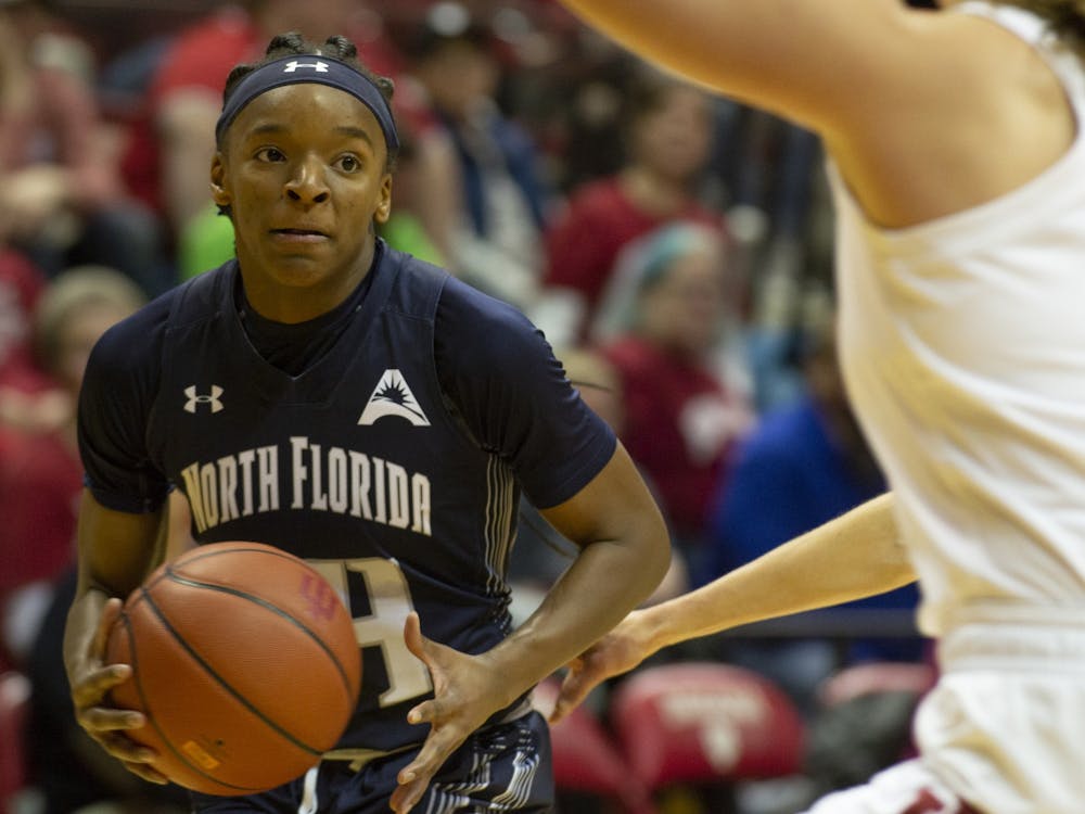 The University of North Florida's Janesha Green looks for an open player Dec. 7 at Simon Skjodt Assembly Hall. Green scored a team high 13 points in North Florida's loss to No. 14 IU.